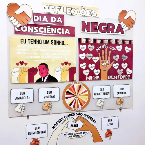 Painel com mensagens sobre consciência negra e diversidade de cores de pele.