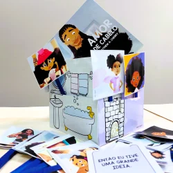 Caixa com ilustrações de personagens com cabelo afro e história infantil.