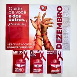 Painel de conscientização sobre HIV/AIDS e prevenção com mãos e laços vermelhos.