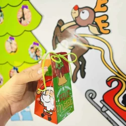 Miniatura de presente de Natal com tema festivo e mensagem de Feliz Natal.
