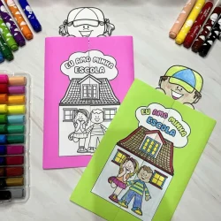 Desenhos de crianças e escola em papel colorido com giz de cera.
