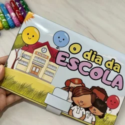 Livro infantil com tema do dia da escola e desenhos de crianças felizes.