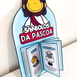 Luva livro com símbolos da Páscoa e personagem sorridente.