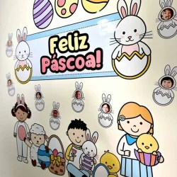 Decoração de Páscoa com coelhinhos, ovos coloridos e mensagem de Feliz Páscoa.