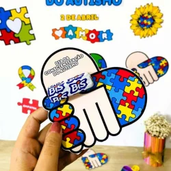 Cartaz com símbolos do autismo e atividades educativas.