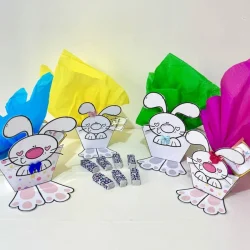Caixinhas de Páscoa com coelhinhos de papel decorativos coloridos.