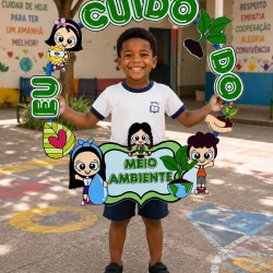 Criança segurando quadro com mensagem de cuidado ambiental.