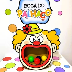 Brinquedo de boca de palhaço com bolas coloridas para diversão infantil.