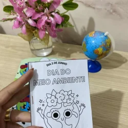 Cartaz do Dia do Meio Ambiente com desenho de planeta e flores.