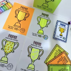 Cartões de homenagem ao Dia dos Pais com troféus coloridos e mensagens especiais.