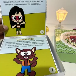 Ilustrações de personagens folclóricos brasileiros em livro educativo.