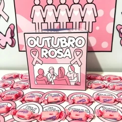 Campanha Outubro Rosa com símbolos de conscientização e prevenção ao câncer de mama.