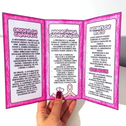 Folder informativo sobre câncer de mama e prevenção com símbolo de conscientização rosa.