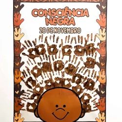 Cartaz de Consciência Negra com mãos e rosto de criança.