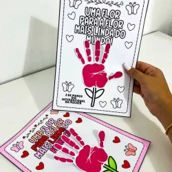 Atividade do Dia da Mulher com mãos pintadas e flores coloridas.
