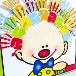 Mãos de papel coloridas formando uma coroa ao redor de uma criança desenhada.